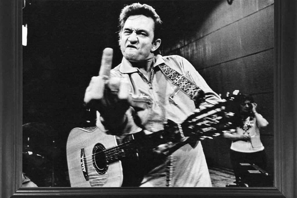 san quentin prison performance, johnny cash used country music to voice his concerns about those who were dealt a bad hand in life