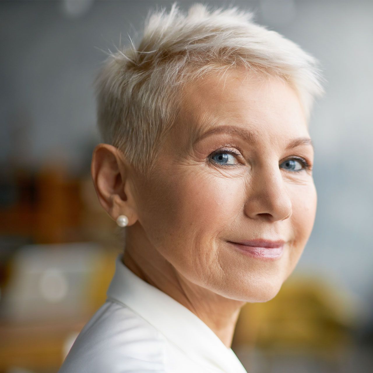 elderly woman with a layered pixie hairstyle ideal for thinning hair
