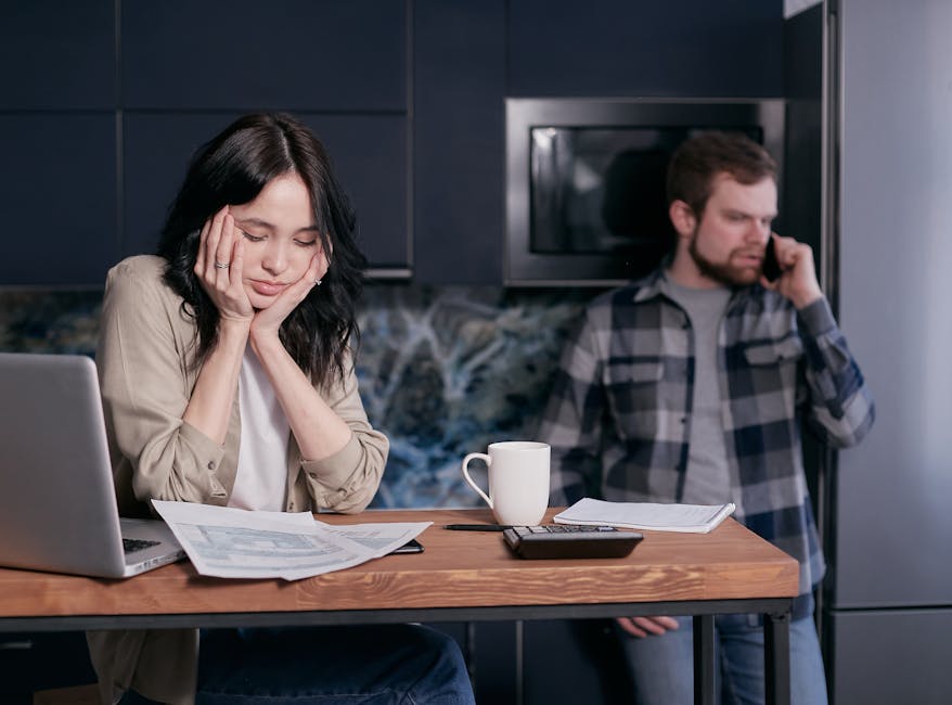 Frustrated modern family surrounded by tax documents and computer
